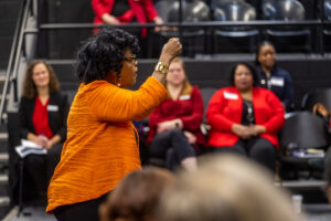 Woman using hand gestures while giving speech