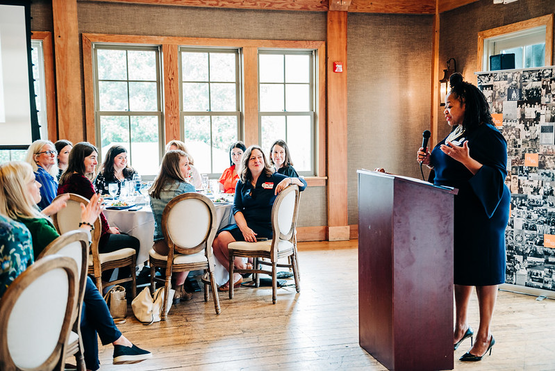 Woman giving speech at a podium