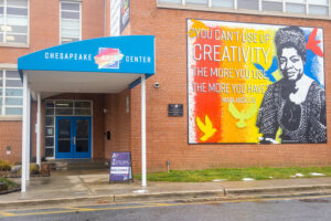 Front of building with colorful banner