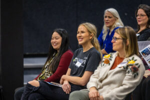 Women smiling looking forward